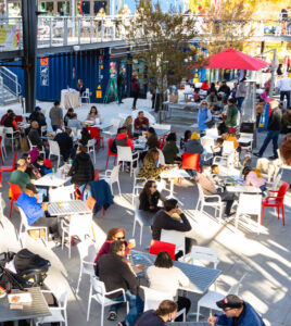 People sitting at tables in Boxyard