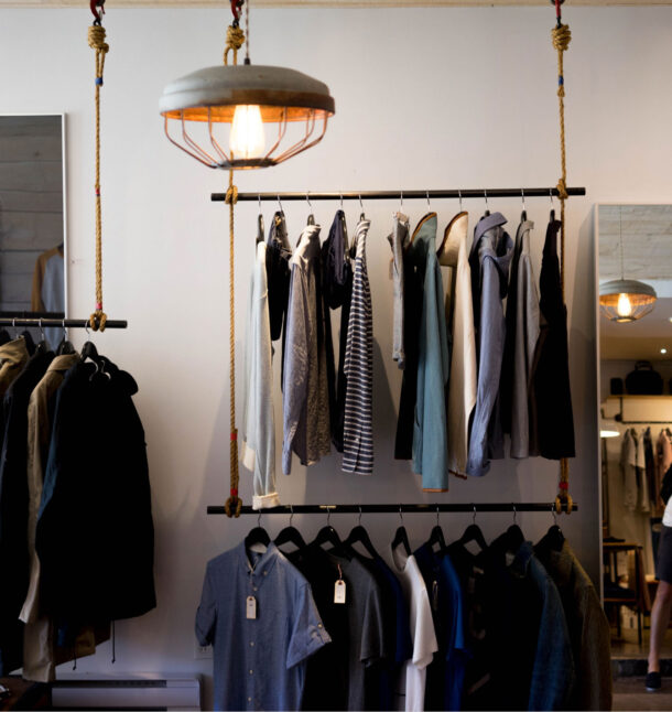 Clothing shop with racks of mens clothing